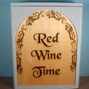 A box for dispensing bag-in-the-bag wine. The box has a white marble frame and an engraved oak panel that reads "Red Wine Time."