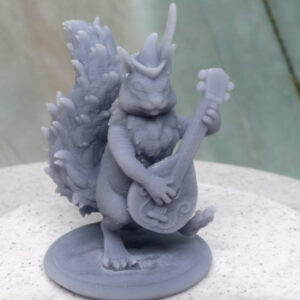 A gray plastic miniature of a squirrel folk adventurer playing a lute.