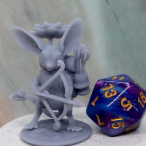A 3D-printed tabletop miniature of a Jerboa character holding a bow and arrow, next to a twenty sided die.